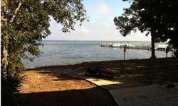 This property is .84 of an acre of WATERFRONT on the Choctawhatchee Bay. The property currently has 2 houses: a 2,940 sf house on the bay and a 2,033 sf house on the front end of the property. This property has been rented out and leases expire in 2012.