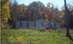 GREAT FIRST TIME HOMEBUYER/INVESTOR OPPORTUNITY. Clayton home features split floor plan with three bedrooms and two full baths. Lovely oak cabinets in eat-in kitchen. Large, open, living room. Beautiful country views. Wooded in rear of property. HOMEOWNER