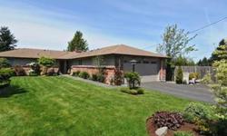 Timeless, mid-century modern/beautiful hardwoods, slate entry, vinyl windows. Gorgeous gardeners green views from every window! The setting is so private and nicely protected for animals or little ones. The circular floorplan is fabulous for entertaining.