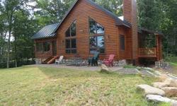 Custom built log sided Chalet is located in private gated Frontier Lakes. Great room offers cathedral ceiling, stone fireplace, 3 bedrooms, 2 baths, open loft, four-season room and much more. There is a wall of windows with breathtaking views of Twin