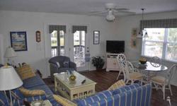 Enjoy the Sunshine and Sea Breezes from the deck of this 4 bedroom canal duplex! This is a rare find and an opportunity not to be passed by. Recent updates include new kitchen and bath cabinets, carpet, floors and furniture. The current owners have added