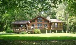 SPECTACULAR LOG CABIN SIDED HOME WITH 424 FEET OF ROCK RIVER FRONTAGE! VACATION RIGHT AT HOME AND ENJOY THE PEACE & SERENITY THIS 5 ACRE WOODED PROPERTY OFFERS. INVITING, SPACIOUS ROOMS, LIVING RM W/FIREPLACE, WET BAR & WESTERN RED CEDAR VAULTED CEILING,
