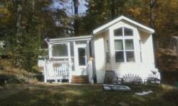 36' X 12' 1999 Breckenridge Trailer w/lot. 1br w/den, full kitchen with full sized appliances, bathroom with shower & tub, new 12' X 10' shed, 24' X 10' screened porch, wrap around deck. Lots of storage. Located in Tall Timbers, a seasonal vacation
