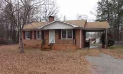 Cute, all brick house on large corner lot in convenient area. House has nice sized family room with wood burning fireplace, eat-in kitchen with stove, separate laundry and 2 bedrooms. One bedroom with 2 closets. Yard is level and backyard is fenced. Has