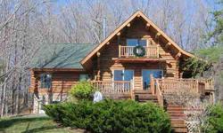 On a bluff just the Boyne City side of Horton Bay, a log home overlooks Lake Charlevoix. Sleeping 14, with two lofts and expansive decking, this home is on 7 wooded acres close to town, but completely private and secluded. The kitchen has an antique wood