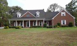 Beautiful 2 Story Brick Sitting on a Hill with 8.5 Horse Friendly Acres, In ground swimming pool (18,x36,) new liner installed in April 2010, Large Metal Barn,(36 x24 ); includes 2 stalls, tac area, 10 x36 overhangs, with elec utility, pond and large