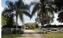 Beautiful Lake Gibson spacious lakefront true brick home with expansive lake views, is a gated and fenced private .75 acre. Caged pool and spa along with connecting large Florida Room overlooks southern and western views. Home has 5 Bedrooms and 5 1/2 bat