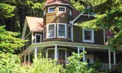 Victorian "Queen Anne style" Lake front home. Built 1992. Five + acres on the Shutters Arm of South Tenmile Lake in a wonderful Cove. Good Road and Boat access. Wonderful Boat House. This home has 3 bedrooms and 3 baths over 1850 sq.ft. of fine