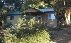 Private Oak Forested Retreat located in the community of Cuyamaca Woods with 2BR/1BA, 1200 sq.ft. Price $395,000.Cottage in two lots totaling 7.35 Acres Newly built in 2005 with great room added in 2012, this home meets the latest in energy efficiency and