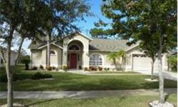 Lake and preserve views from this 4 bedroom 2 bath pool home in Pineda Crossings. Formal living and diningrooms. Plantation shutters, familyroom with fireplace. Eat in kitchen with sliders to screened and covered heated pool. Spacious mastersuite and