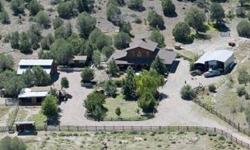 Gentleman's Ranch off the grid. Solar home only. 1.3 miles from paved road. Stunning peaceful lush setting on 15 acres. Great water, barns, out buildings, fruit trees and more. Custom Ranch home is 2 bedroom, 2 bath, 2,160 sf and 2 room bunkhouse, wrap