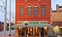 Magnificent is the word that will come to mind when you first see this property ~ Originally built in 1895 as Hill's Dry Goods store and is a classic example of commercial structures at the turn of the century. Original mosiac decorative tiles grace the