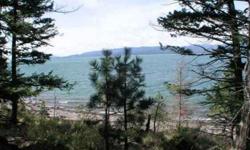 Flathead Lake lot with good beach stretching 104'. West facing right over lake makes for lengthy afternoons and great sunsets. Land conducive to designs with walk-out lower levels. Lot is approved for an engineered septic system. Just minutes from the