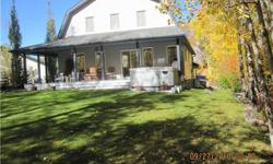 One of a kind custom cuilt "barn" style home set on 2 full lots, nicely landscaped with trees surrounding for privacy. Great quiet community in Westcove, off the shores of Lac Ste Anne. This 3 bedroom home with loft is absolutely immaculate inside and