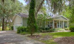 You must see this beautiful Fishhawk Trails home sitting on a heavily wooded half-acre conservation lot! Southern charm graces the wide brick front porch perfect for rocking and watching the world go by! The formal living and dining rooms boast wide
