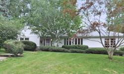 Expansive ranch at corner of tree-lined side street features 2 bdrms and 2.5 baths, incl a master suite. Spacious layout is ideal for gathering and entertaining, with family room off the kitchen. Home features a spacious living room with fireplace, a