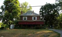 Excellent investment opportunity. Property includes all brick 4 bedroom colonial home situated on 4.9 country acres with a 16 room operating kennel. The home has a wrap around porch, awnings and a detached 2 car Garage. Inside the home, character abounds