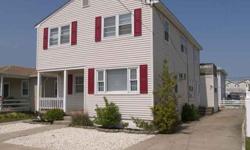 Just a short stroll to the beautiful and free Wildwood Crest beaches, this duplex situated in the south end offers room for you and income too! The first floor has a great front covered porch, 3 bedrooms, 2 full tile baths with tubs, living room, eat-in
