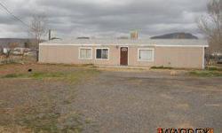 Double wide here in Kingman, commercial residental area, although quite 4 br 2 full baths, split floor plan. Master has garden tub. Has some moisture issues. Sits on 1/2 acre. Needs some major TLC.
Listing originally posted at http