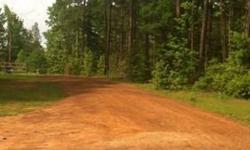 5 acres of land in Rural East Texas. Beautiful Future Home Site. Only 5 minutes to town and 3 minutes to the schools. Property has all utilities and active rural water. Also included is a 2700 sq. ft. slab with plumbing that can be used or if not, can be