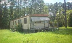 This older 2 bedroom 1 bath single wide mobile home is in need of TLC to make it liveable. Most of the value in in the 135 x 300' corner lot.Listing originally posted at http