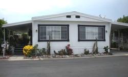 This charming home in the Canoga Estates mobile home community offers