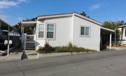 Mobile Home Connection Presents...Fantastic newer 2003 Skyline Manufactured Home in beautiful senior community. This home has a great split floor plan with bedrooms and baths at each end. Large master bedroom with private bath with full walk-in shower.
