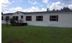 Almost 2 acre lot in North Lakeland, Large double wide mobile home with nice floor plan. If you are looking for country living this is an excellent choice. Home is priced for quick sale. Large Kitchen and nice master bathroom area. Central A/C unit is
