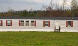 Great Singlewide that only needs a little updating that offers 3 Bedrooms, 2 Baths, 15.8x13.1 Living Room, Large Eat-In Kitchen with Loads of Cabinets, oversized Deck all on a BEAUTIFUL 1.76 ACRE LOT!! Lot has 3 BR Septic so you can remove singlewide and