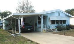 Palm Harbor beauty! Fully furnished 2BR/2BA, 28x53 plus Florida room, dock, deck, & gazebo. Features include newer double pane windows, R/O, bay windows, vinyl siding, inside laundry, foyer entrance, large shed, & an eat-in kitchen! A very large