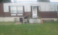 2 bedroom manufactured home in trailer park for sale. Includes appliances, central AC, washer/dryer hookups, and shed in back.. Selling it as-is.