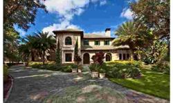 Escape to the comforts and magnificence of a luxury mountain resort within The Oaks, one of Sarasota's most desired master-planned communities. Set on a well-manicured, private cul-de-sac, this remarkable home was inspired by both the Neiman