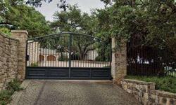 A privately gated entrance opens to an elegant, traditional Austin estate on nearly 1.5 park-like acres. This home is located at the top of one of the most prestigious tree-lined streets of Westlake. Million dollar views of downtown and Lake Austin from