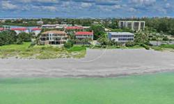 Dramatic gulf views throughout, sounds of the rolling waves and spectacular sunsets are found in this picture perfect tropical retreat. The property is situated on almost 100' of Longboat Key's finest beach and showcases a private heated pool.You are