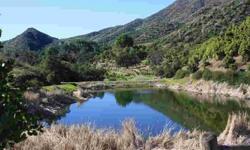 This property represents a rare opportunity to own a beautiful home surrounded by ponds, creeks and hiking & equestrian trails in the exclusive gated Hermitage Ranch located in the East end of Ojai. This parcel also has an equestrian arena, stalls and a