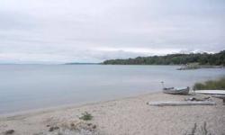 Chalet Style home with private Omena Bay frontage on Grand Traverse Bay! - Enjoy the protected waters on Omena Bay from this unique property with 146' of private frontage, a sandy beach and water depths that are ideal for the boating enthusiast. -