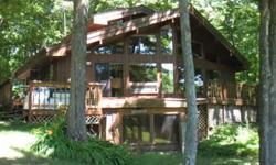 Carve your own paradise out of this large 12.86 acre, well-conserved area on prime Lac Courte Oreilles lakeshore with 770 feet of level frontage. The owners have made an ecologically small footprint for their home which enables you to continue to preserve