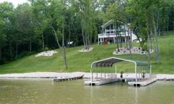 Welcome home to beautiful 700 Crystal Lake Drive in Warsaw, Kentucky. This stunning four bedroom home offers 2.12 gorgeous acres, a two car garage, a fully finished basement with walkout to the patio, views of Craigs Creek, two docks and so much more!!!