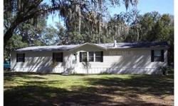 * This spacious 4 bedroom/2.5 bath double-wide mobile home with its 2,280 square feet of living space is located just west of Zephyrhills on a l acre lot. Plenty of space for parking and outdoor activities here. The home has a huge living room with a