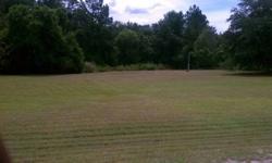 2.6 acres on paved roads ,233 ft wide road frontage, 523 ft deep .Already has land improvements includes septic, electric,community water ,about one acre cleared. Ready to move on ,manufactured homes permited. 1mile from I-16 and the industrial park.