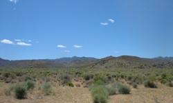 6 level to gently rolling acres, 16 miles north of Kingman. Sandy loam soil, adjoins Az. state land, secluded yet very accessible. Power, phone & internet available. At the base of the Cerbat mountains, 50 miles from Lake Mead, Grand Canyon and Colorado