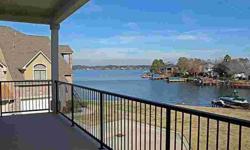Open water view on the shores of Lake Conroe. New construction, over 4000 sqft w/3 enormous bedrooms, 3 full baths, 2 baths, media room & gameroom. Granite in all baths, gameroom & kitchen, hardwood & travertine floors, slate backsplash. 2 fireplaces-1 in