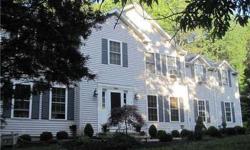 Beautiful colonial on private road, end lot. Master suite w/ vaulted ceiling, jaccuzzi, walk-in closet. Four bedrooms, EIK, Family Room, Living Room w/ fireplace and formal dining room. Fenced in yard, LL walk-out just wtg to be finished. A must