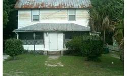 Short Sale. Income property located within walking distance of Downtown DeLand. This is an older frame building that has been divided into 3 apartments. The owner previously occupied one of the downstairs units. Property is in need of extensive repairs