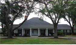 Colonial plantation style home on over 200' on the bayou. Formal living & dining off foyer with spiral staircase, separate den with fireplace with wet bar perfect for entertaining, stylish kitchen with wood cabinets, granite & sub zero leads to keeping