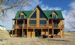 Beautiful River Setting. This 2 Story Log Home Is Nestled Along The Platte River On 5.96 Acres. The Main Floor Master Suite Walks Out To The Wrap Around Decking. The Loft Area Boast Two 12x16 Bedrooms Which Look Out Toward The River. Wood Flooring Along