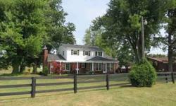 Horse Lovers Dream Now Available! 19.65 acres of scenic pasture lands surround the stately Traditional Brick home with partial basement. Home was extenstively updated in 2005
