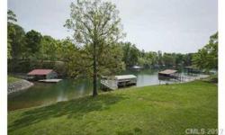 Waterfront Ranch w/ in-ground pool, outdoor patio, spacious deck, covered dock w/ Gazebo - perfect for entertainment! Kitchen w/ wraparound bkfst bar & plenty of counter and cabinet space open to Great Room w/ wood burning fpl and Dining area w/ walkout