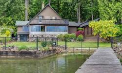 Tranquil, peaceful setting just like Golden Pond, approximately 120 lake front with boat ramp and dock with great bass fish and water sports. Gated entry with entire parameter fenced, towering fir and cedar trees yet lots of natural light. Large open