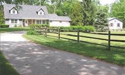 The appeal of this Cape Cod from a distance gets even better as you follow a curved driveway lined by a rustic fence and lush landscaping. This is "Hickory Hill". Two bedrooms down and 2 bedrooms up - you have your choice! Hardwood floors, exceptional